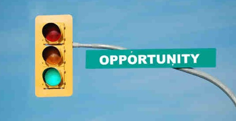 traffic light with sign on it saying opportunity